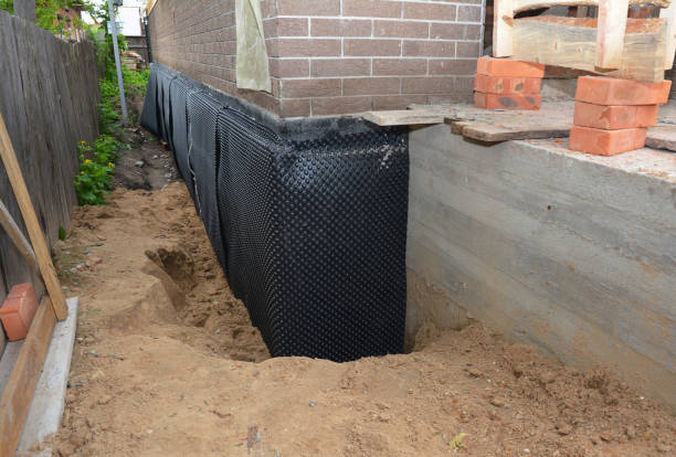 Happy homeowners after waterproofing job in Lancaster
